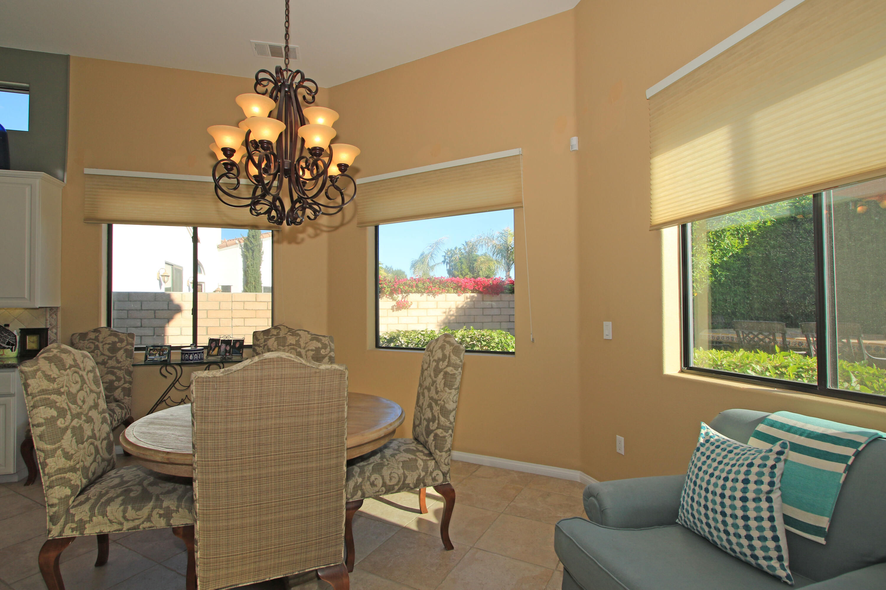 57576 Santa Rosa Trail La Quinta, CA 92253 - Photo 21 of 54 a living room with furniture a chandelier and a large window