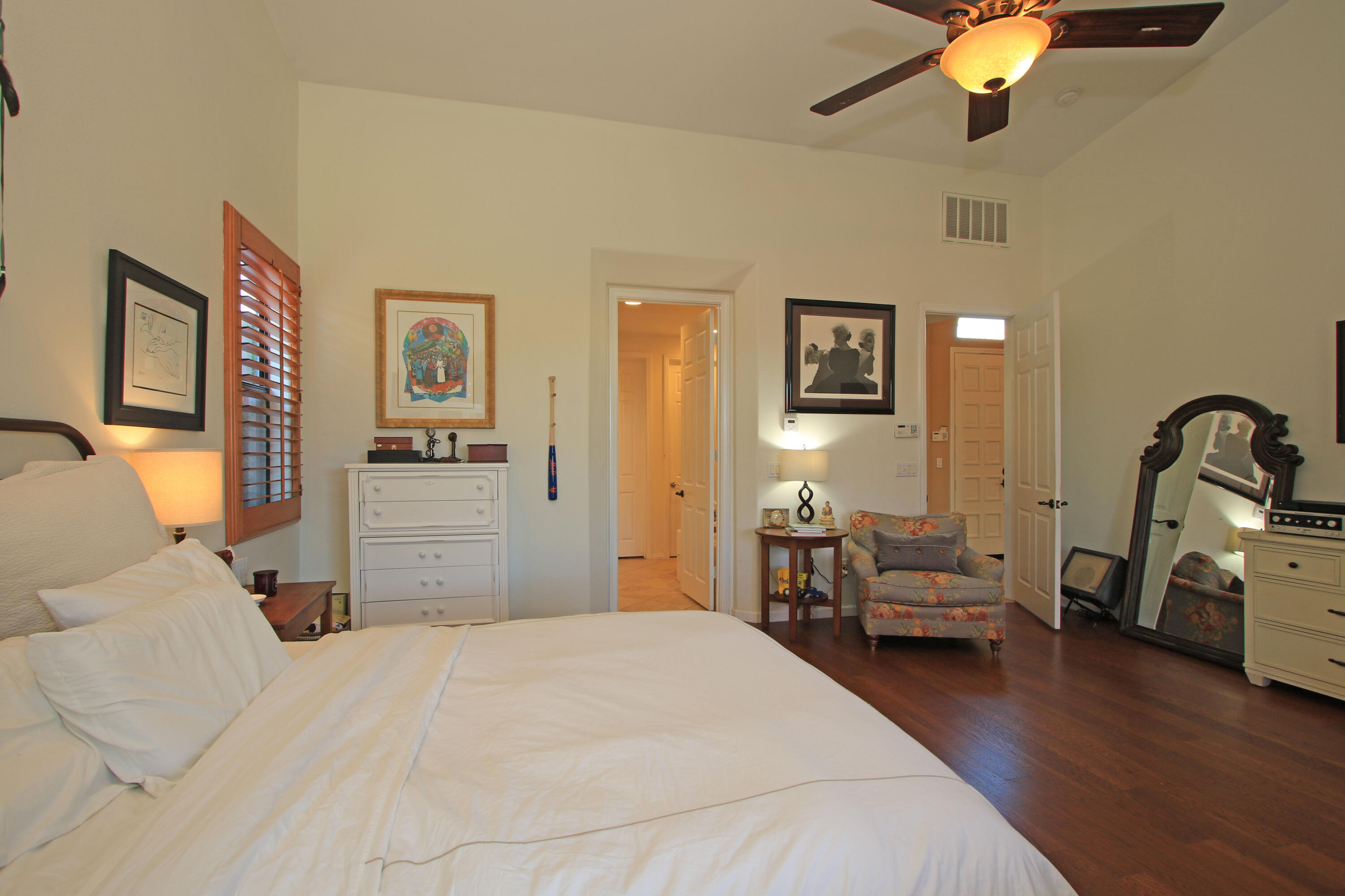57576 Santa Rosa Trail La Quinta, CA 92253 - Photo 25 of 54 a bedroom with a bed and wooden floor