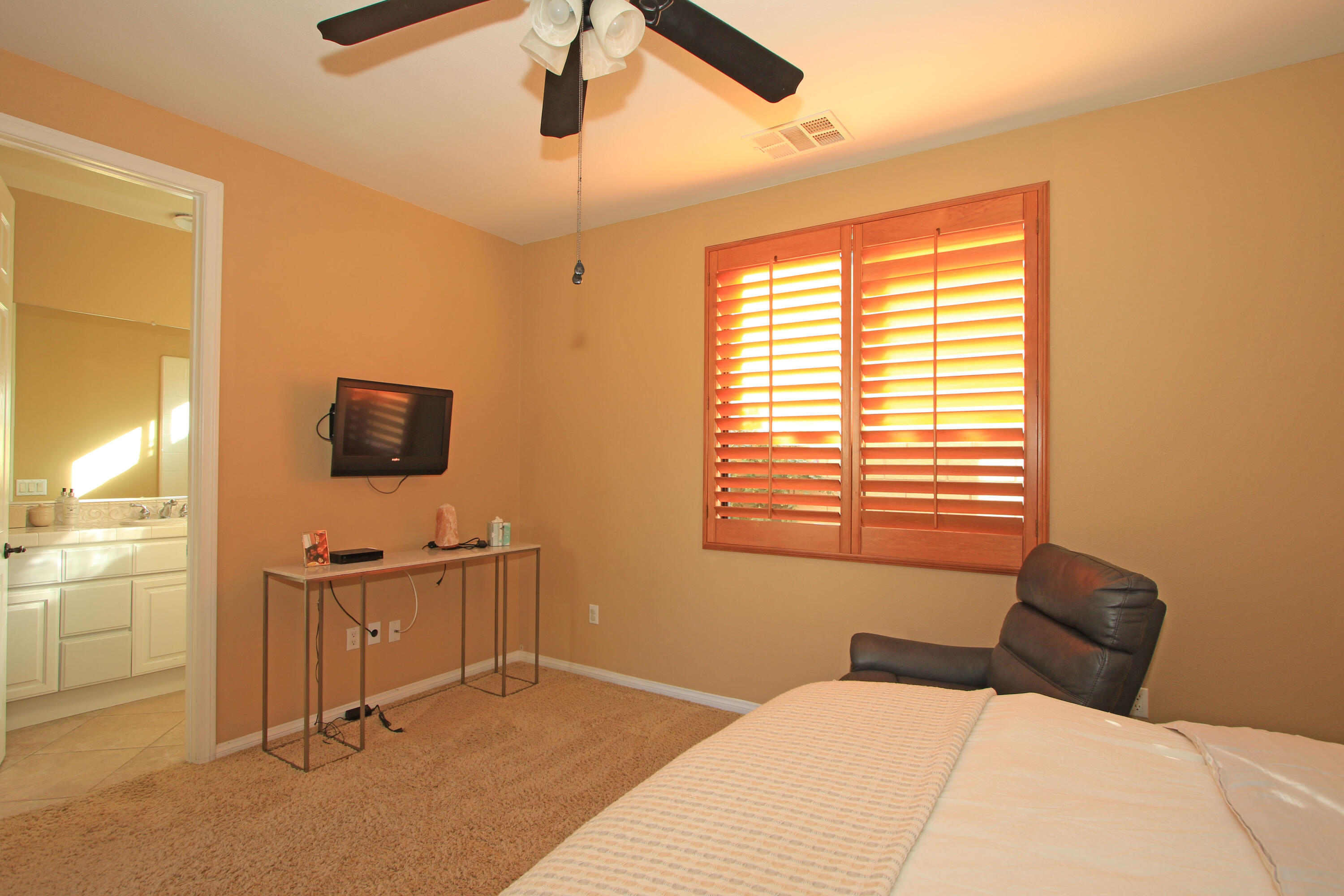 57576 Santa Rosa Trail La Quinta, CA 92253 - Photo 31 of 54 a bedroom with a bed and a flat screen tv