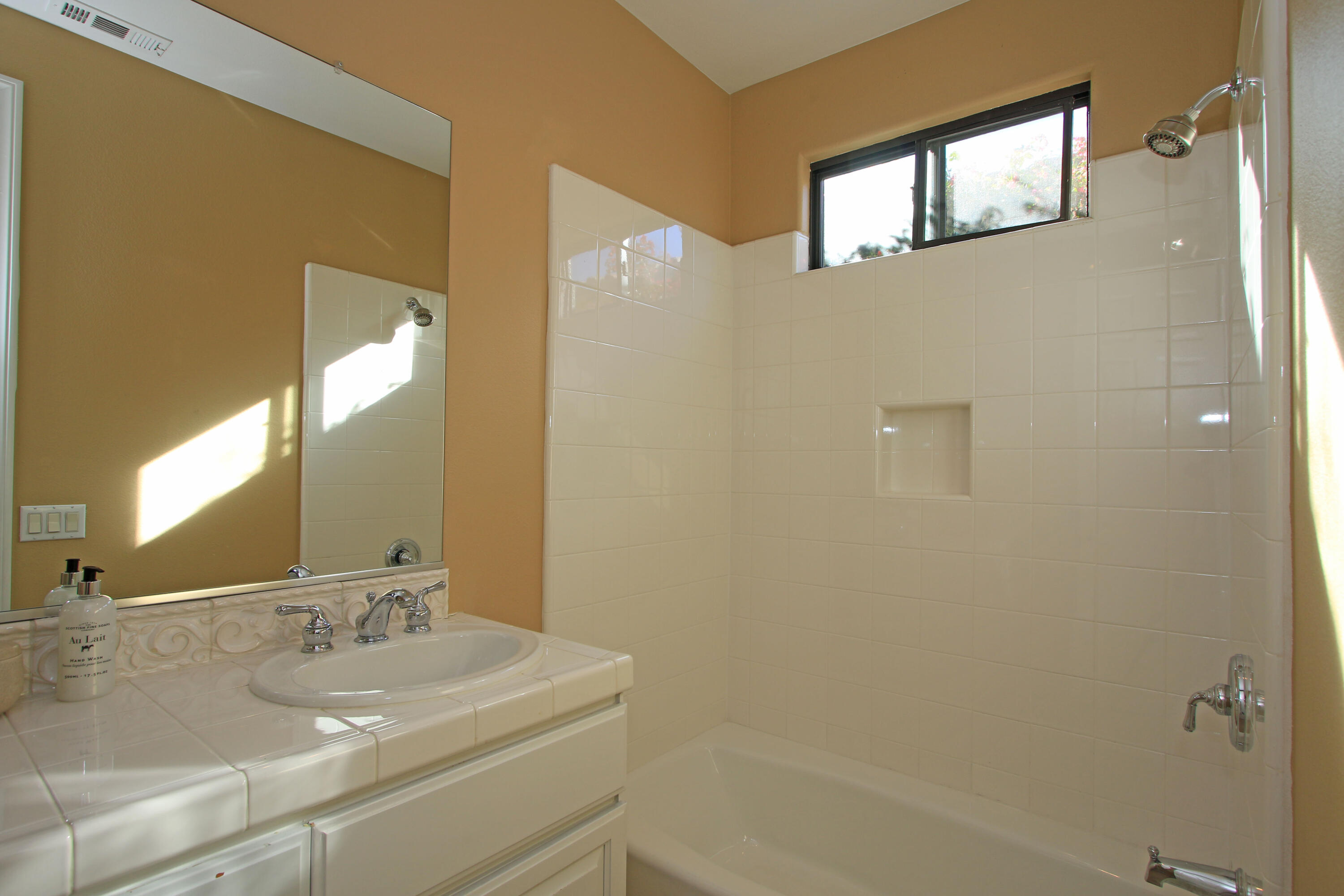 57576 Santa Rosa Trail La Quinta, CA 92253 - Photo 32 of 54 a bathroom with a sink and a mirror