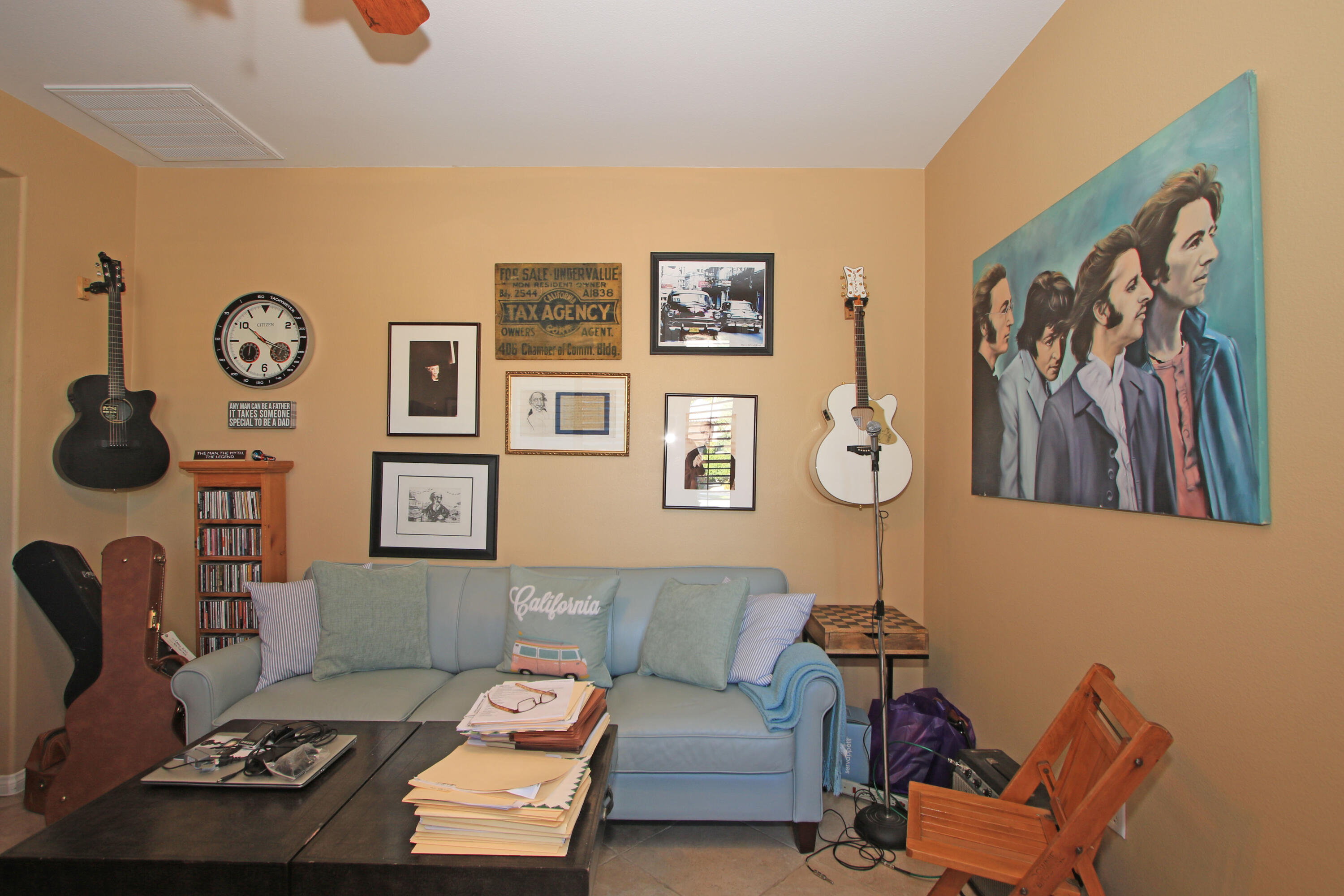 57576 Santa Rosa Trail La Quinta, CA 92253 - Photo 33 of 54 a living room with furniture and wall paintings