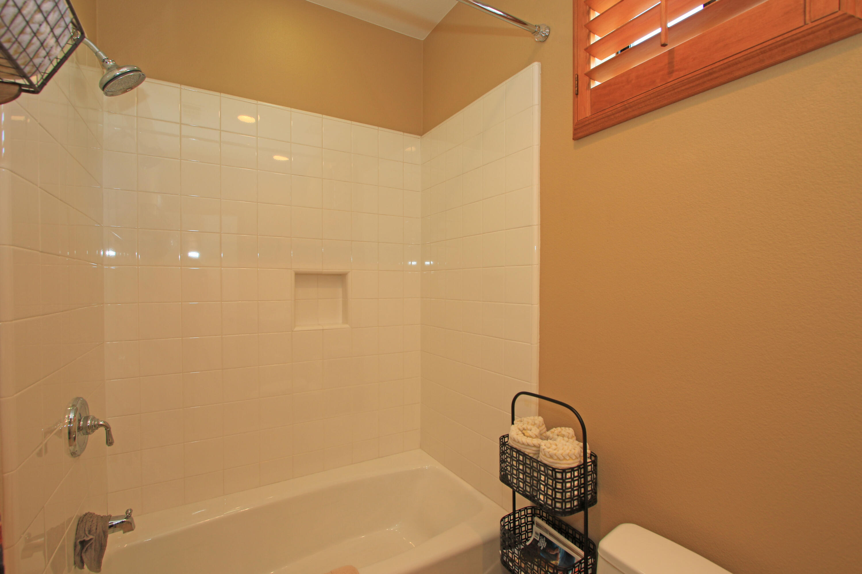 57576 Santa Rosa Trail La Quinta, CA 92253 - Photo 37 of 54 a bathroom with a granite countertop sink and a bathtub