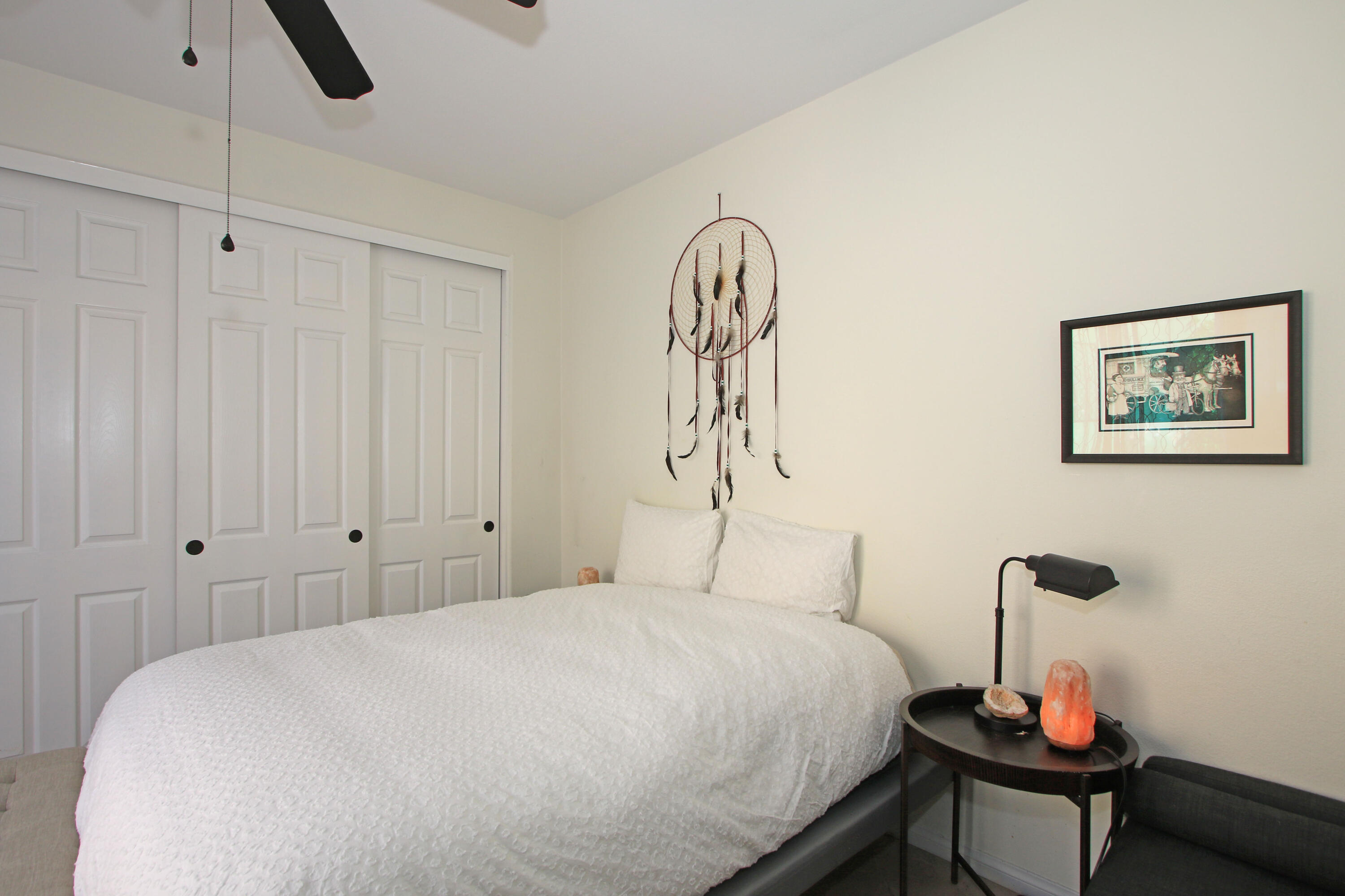57576 Santa Rosa Trail La Quinta, CA 92253 - Photo 38 of 54 a bedroom with a bed and a chandelier