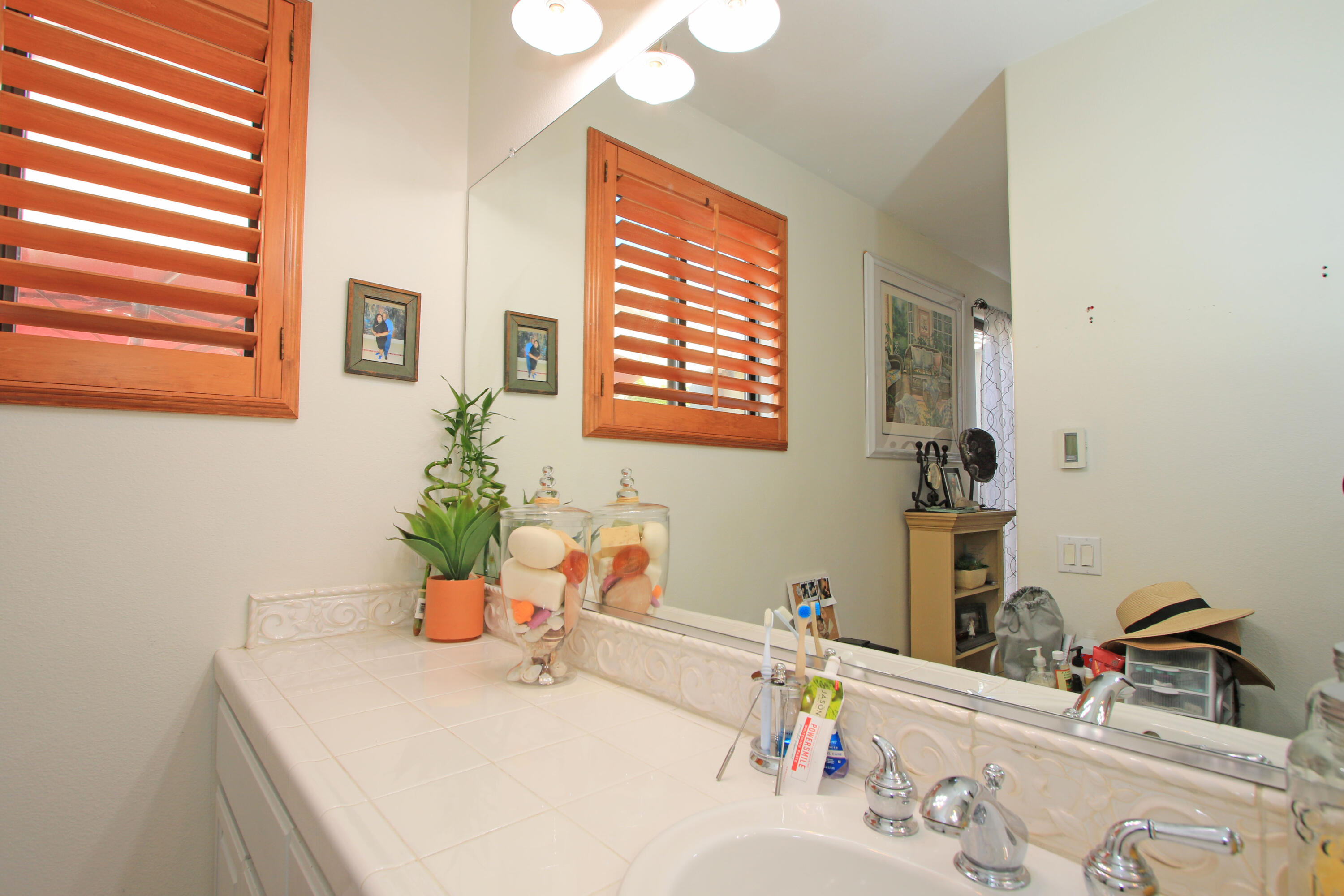 57576 Santa Rosa Trail La Quinta, CA 92253 - Photo 40 of 54 a bathroom with a sink and a mirror