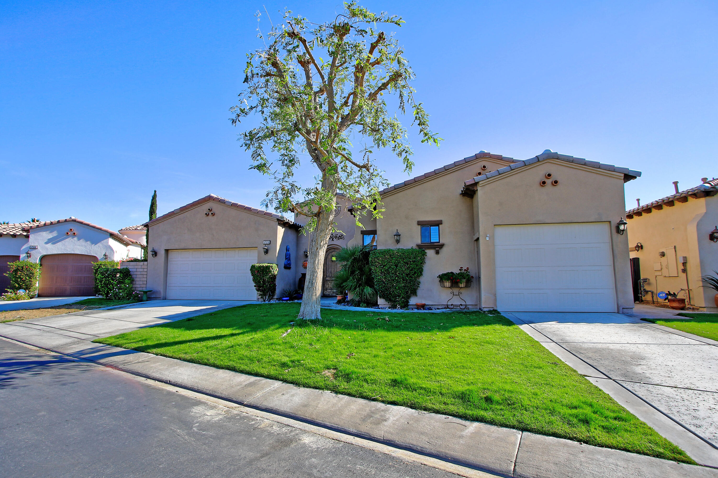 57576 Santa Rosa Trail La Quinta, CA 92253 - Photo 4 of 54 a front view of house with yard and green space