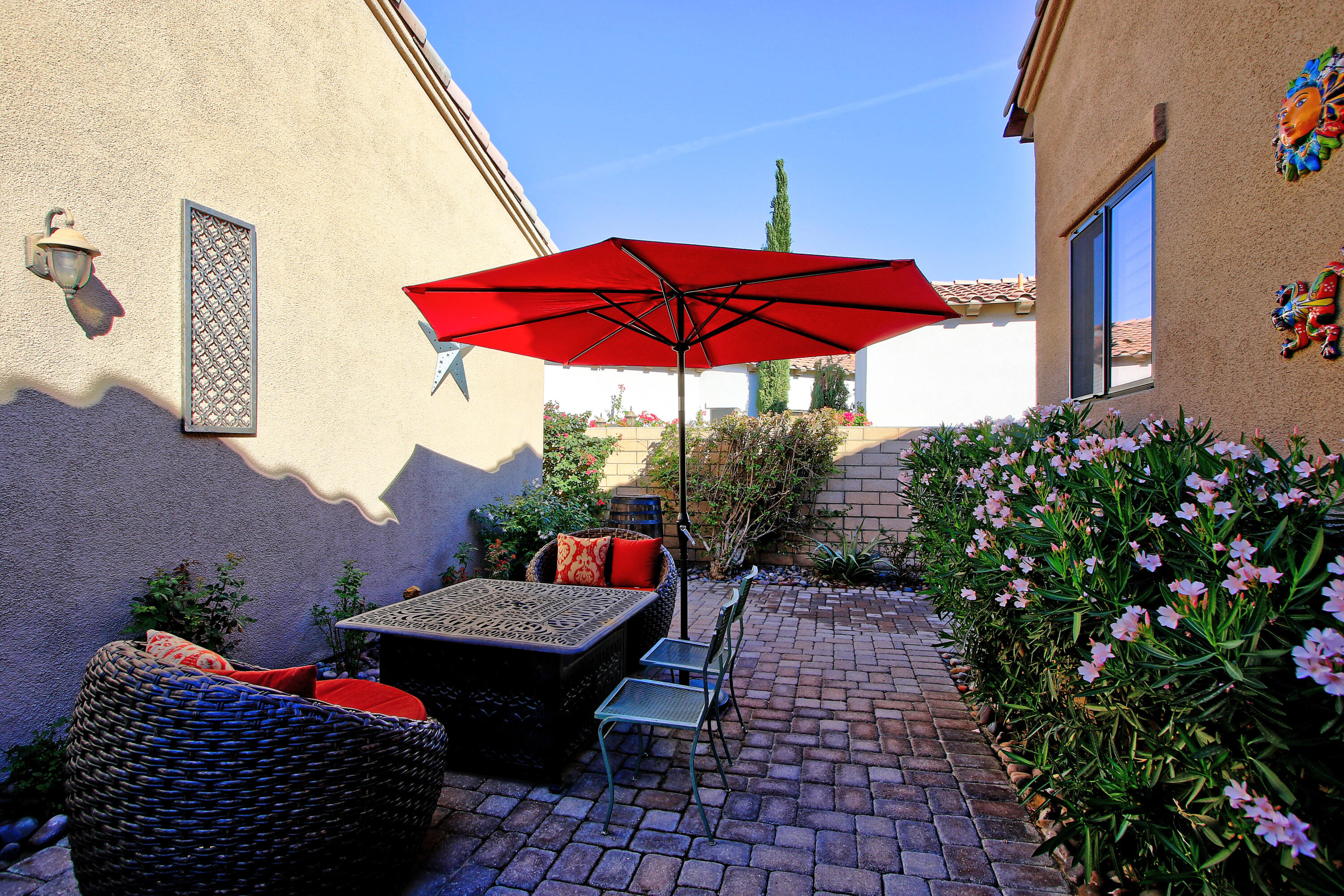 57576 Santa Rosa Trail La Quinta, CA 92253 - Photo 49 of 54 an outdoor sitting area with red umbrella