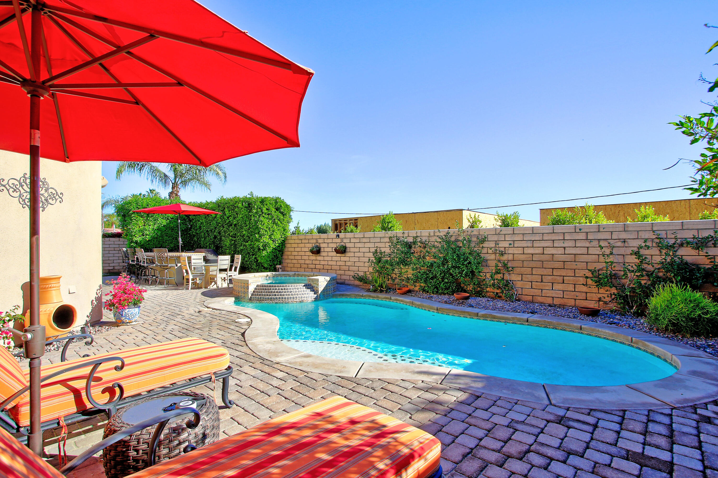 57576 Santa Rosa Trail La Quinta, CA 92253 - Photo 7 of 54 an outdoor space with furniture and umbrella
