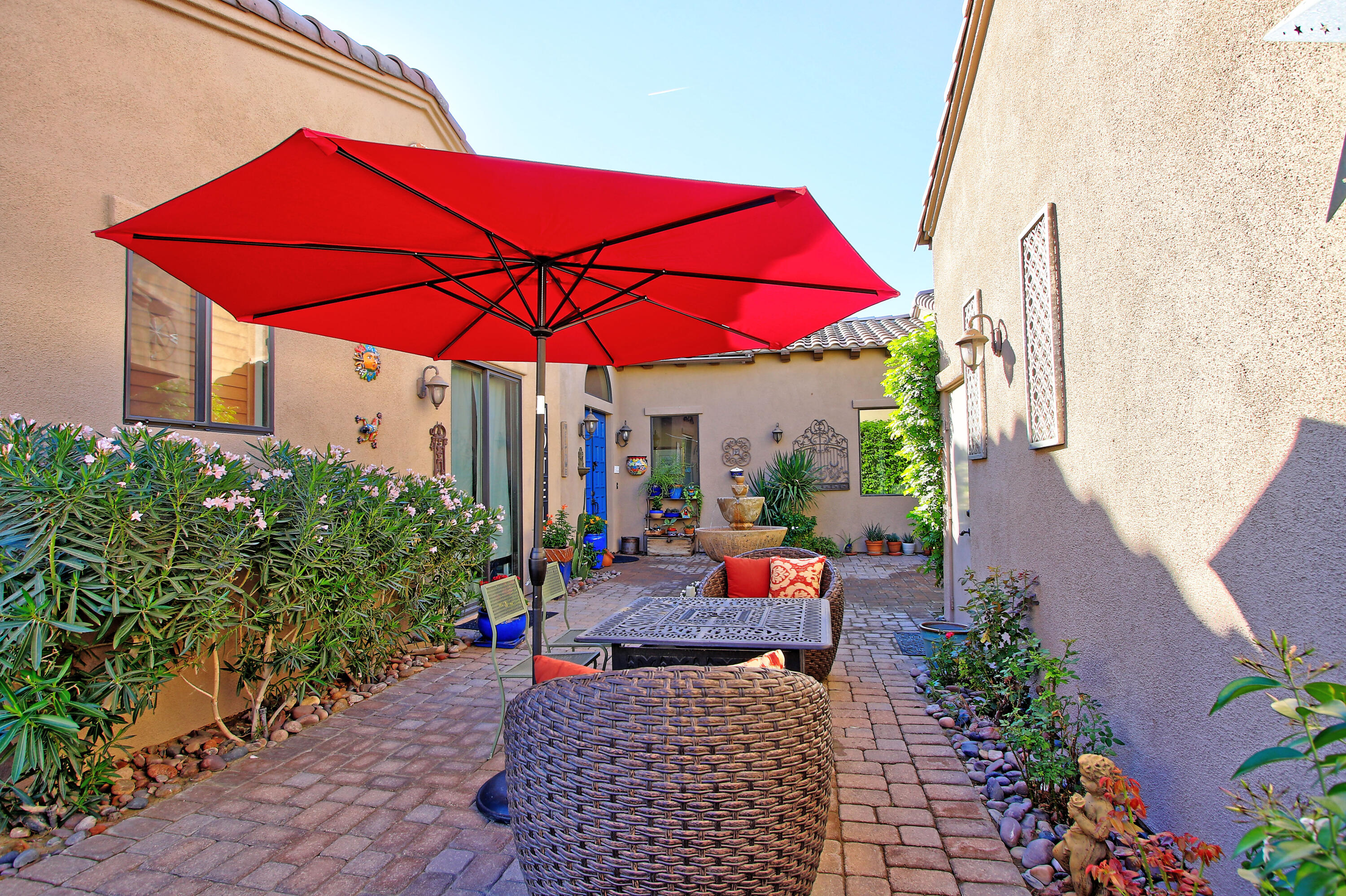 57576 Santa Rosa Trail La Quinta, CA 92253 - Photo 9 of 54 an outdoor space with furniture and umbrella