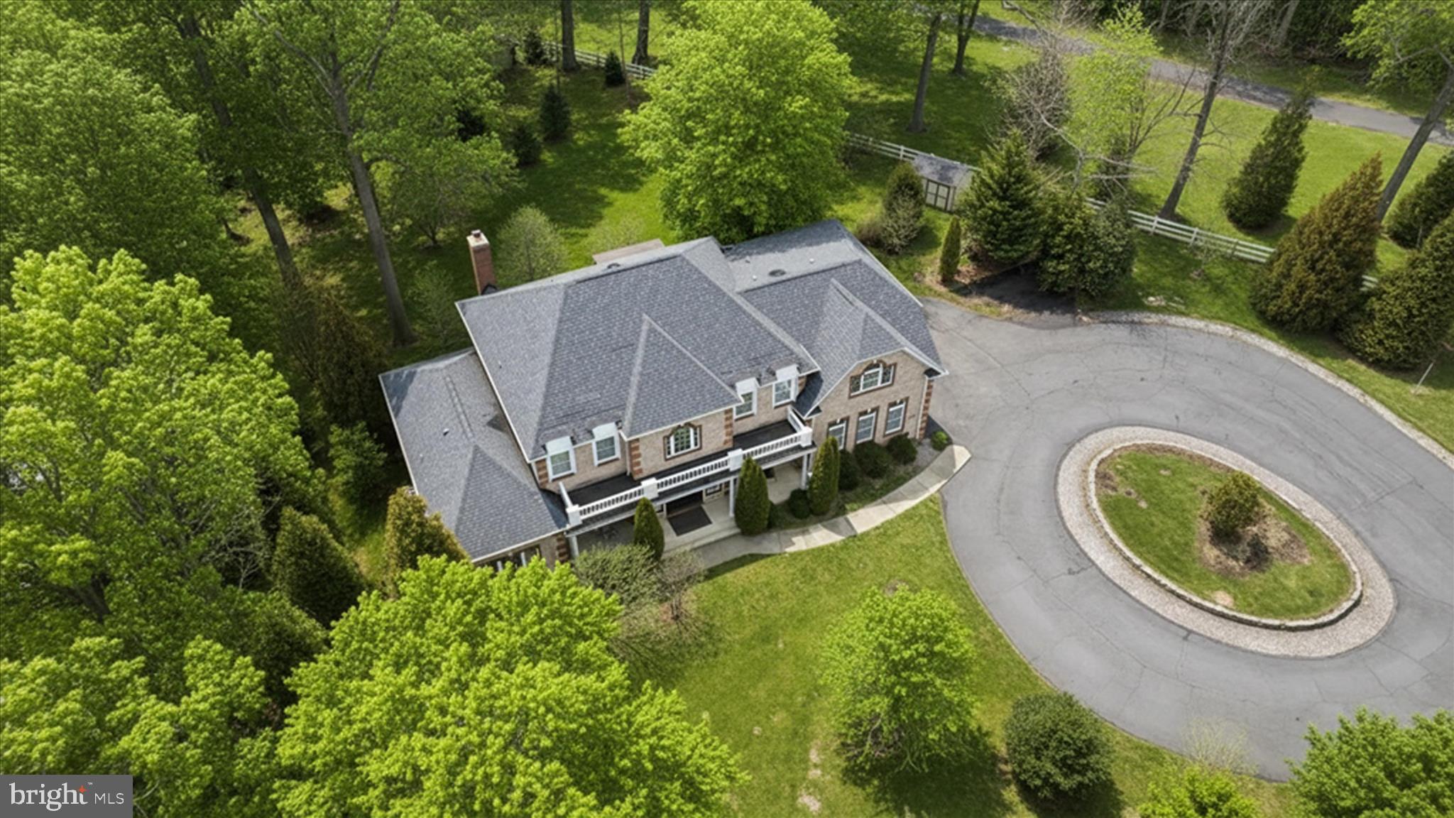 7501 Clifton Road Clifton, VA 20124 - Photo 12 of 93 an aerial view of a house with garden space and trees all around
