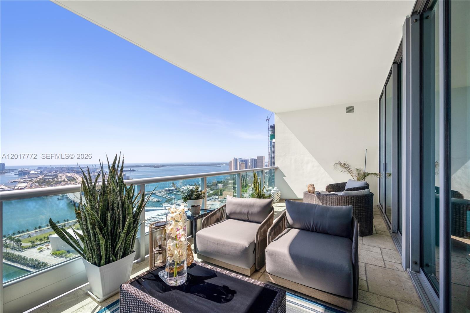 900 Biscayne Boulevard, Unit 4205 Miami, FL 33132 - Photo 12 of 35 a balcony with furniture and a potted plant