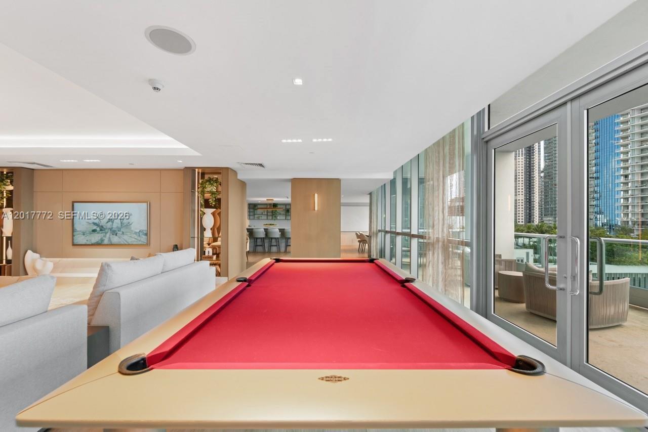 900 Biscayne Boulevard, Unit 4205 Miami, FL 33132 - Photo 18 of 35 a room with pool table and windows