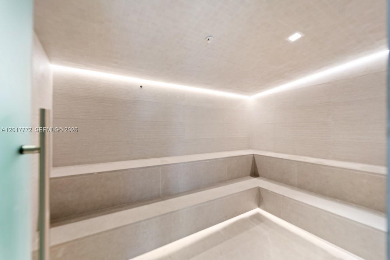 900 Biscayne Boulevard, Unit 4205 Miami, FL 33132 - Photo 21 of 35 a bathroom with a bathtub and shower