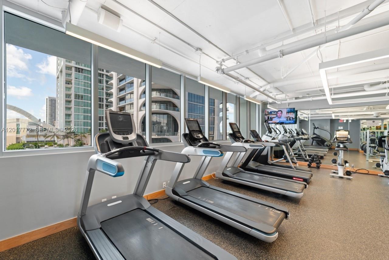900 Biscayne Boulevard, Unit 4205 Miami, FL 33132 - Photo 26 of 35 a view of a room with gym equipment