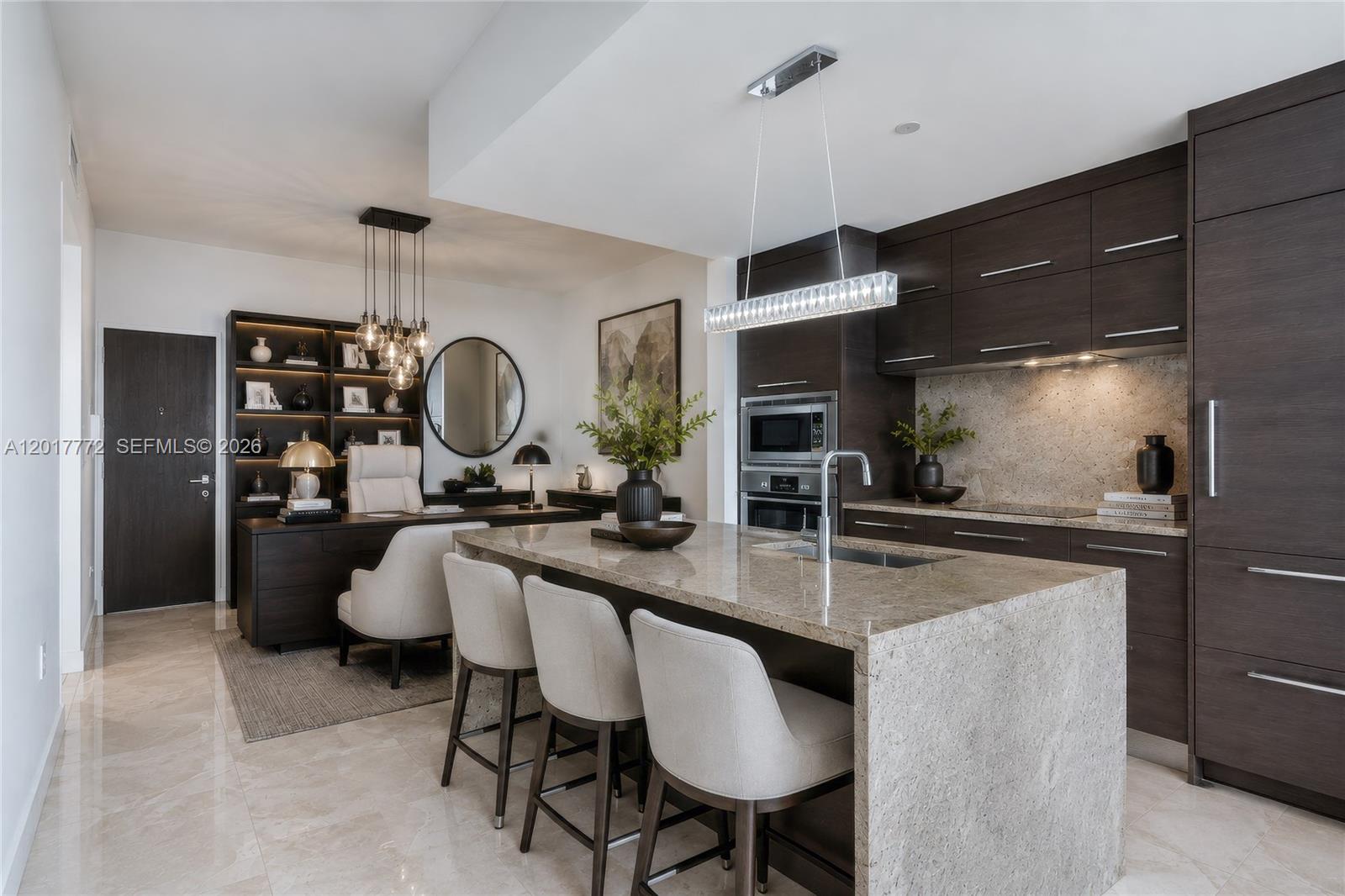 900 Biscayne Boulevard, Unit 4205 Miami, FL 33132 - Photo 3 of 35 a kitchen with a refrigerator and a sink