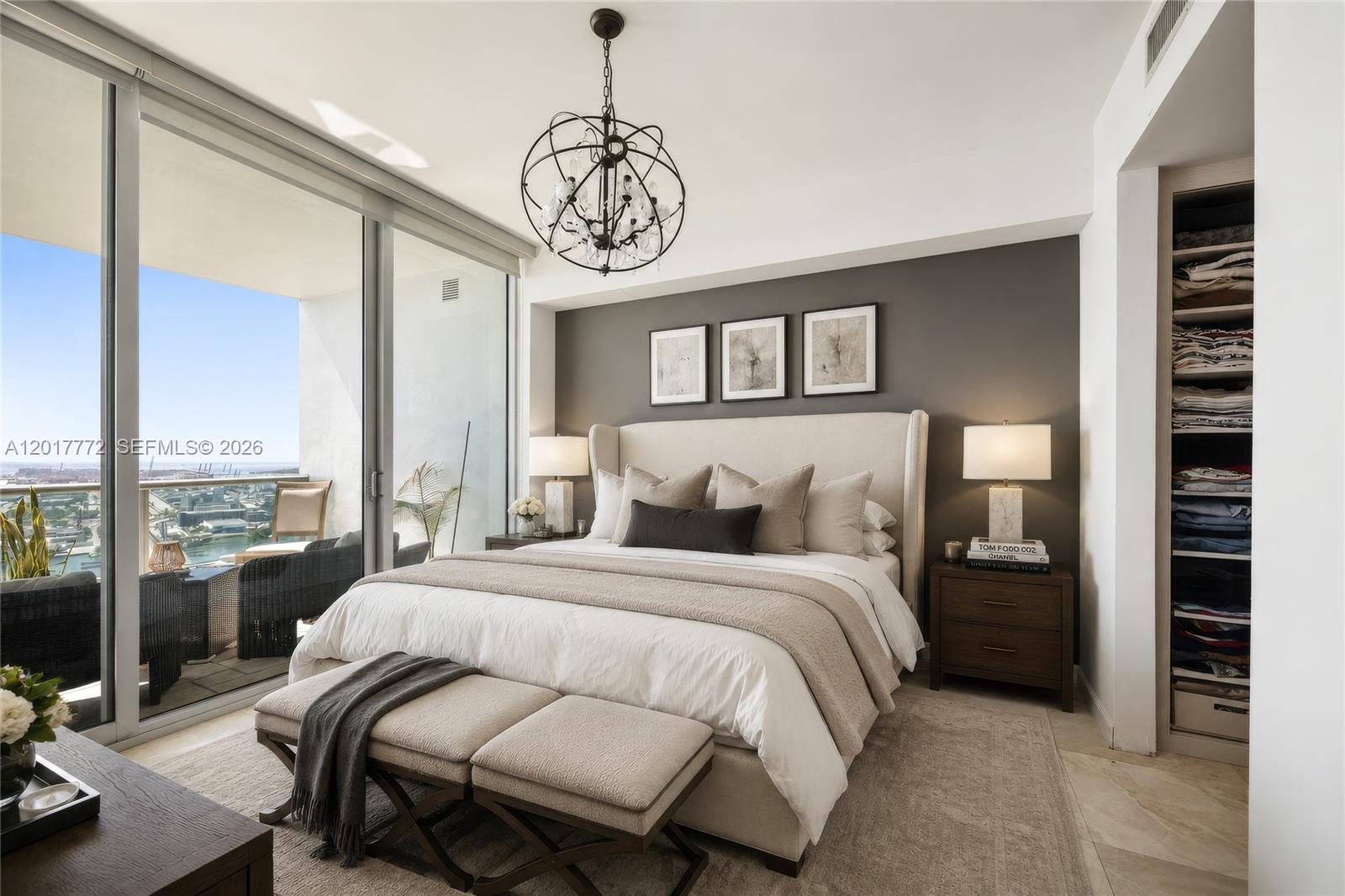 900 Biscayne Boulevard, Unit 4205 Miami, FL 33132 - Photo 5 of 35 a bedroom with a large bed and a chandelier