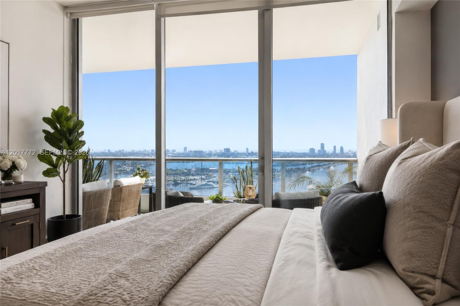 900 Biscayne Boulevard, Unit 4205 Miami, FL 33132 - Photo 6 of 35 a bedroom with a bed and a large window
