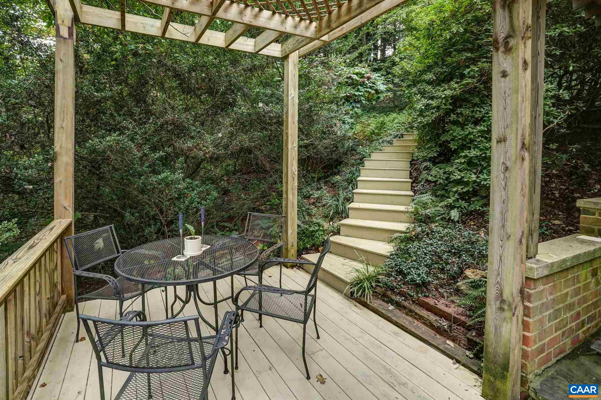 2006 Meadowbrook Road Charlottesville, VA 22903 - Photo 3 of 43 a view of a porch with furniture and a yard