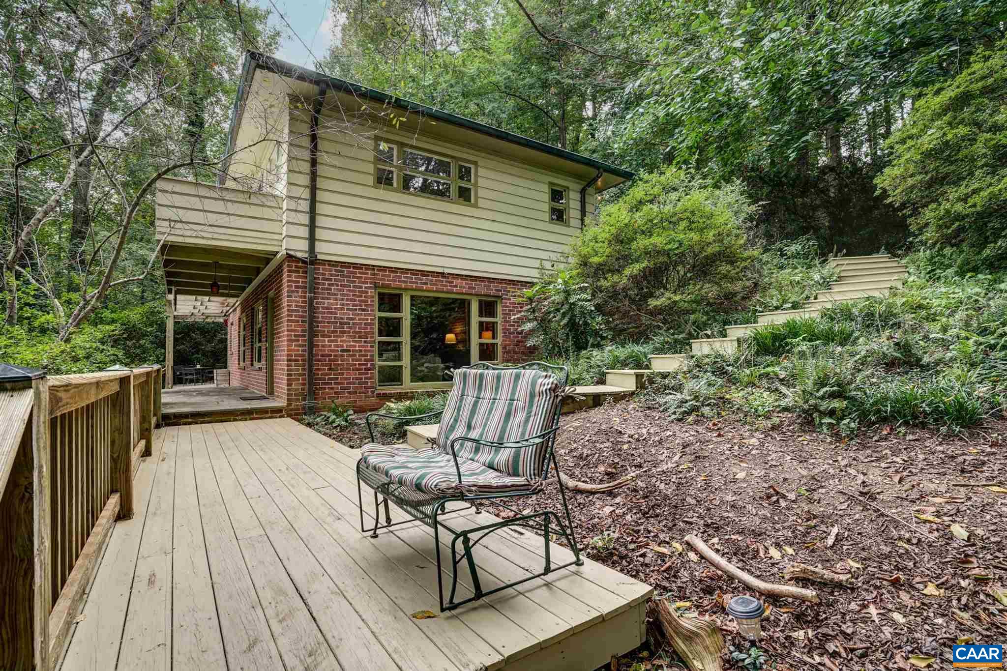 2006 Meadowbrook Road Charlottesville, VA 22903 - Photo 6 of 43 a view of a house with backyard sitting area and garden