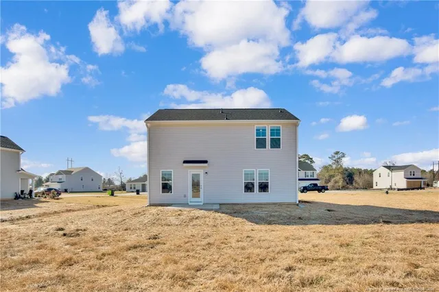 a view of large house with a yard