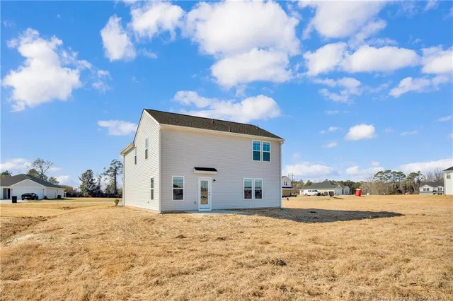 a view of large house with a yard