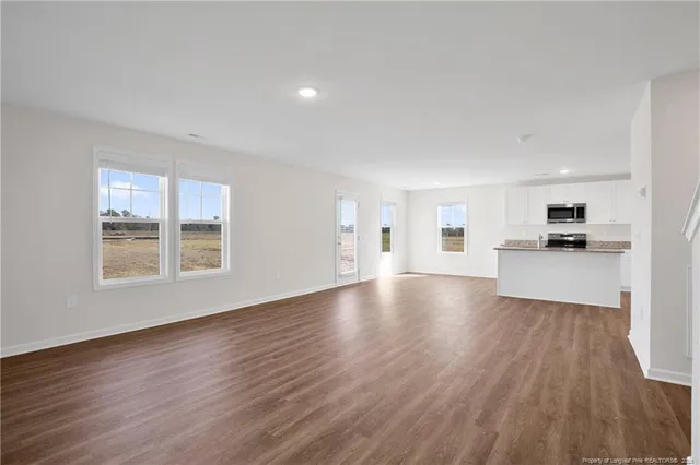 a view of a kitchen with a sink and a stove top oven