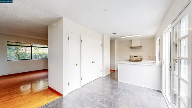 a kitchen with a sink and a large window