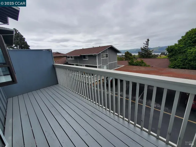 a backyard of a house with outdoor seating