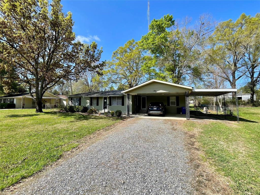 10806 Newson Road Keithville, LA 71047 - Photo 4 of 24 a front view of a house with a garden