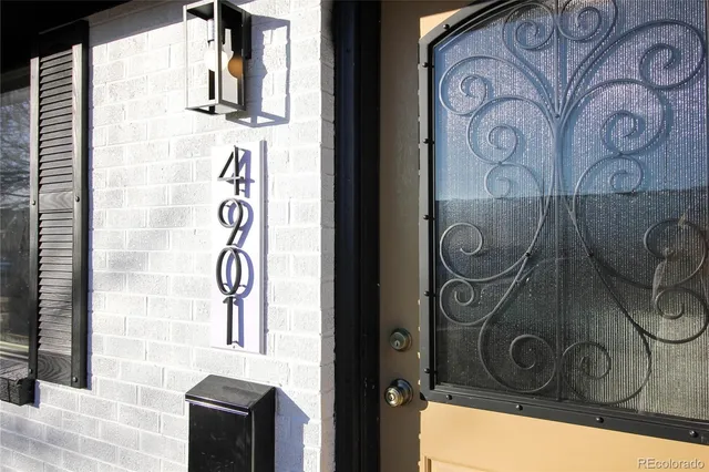 a view of door with wooden wall