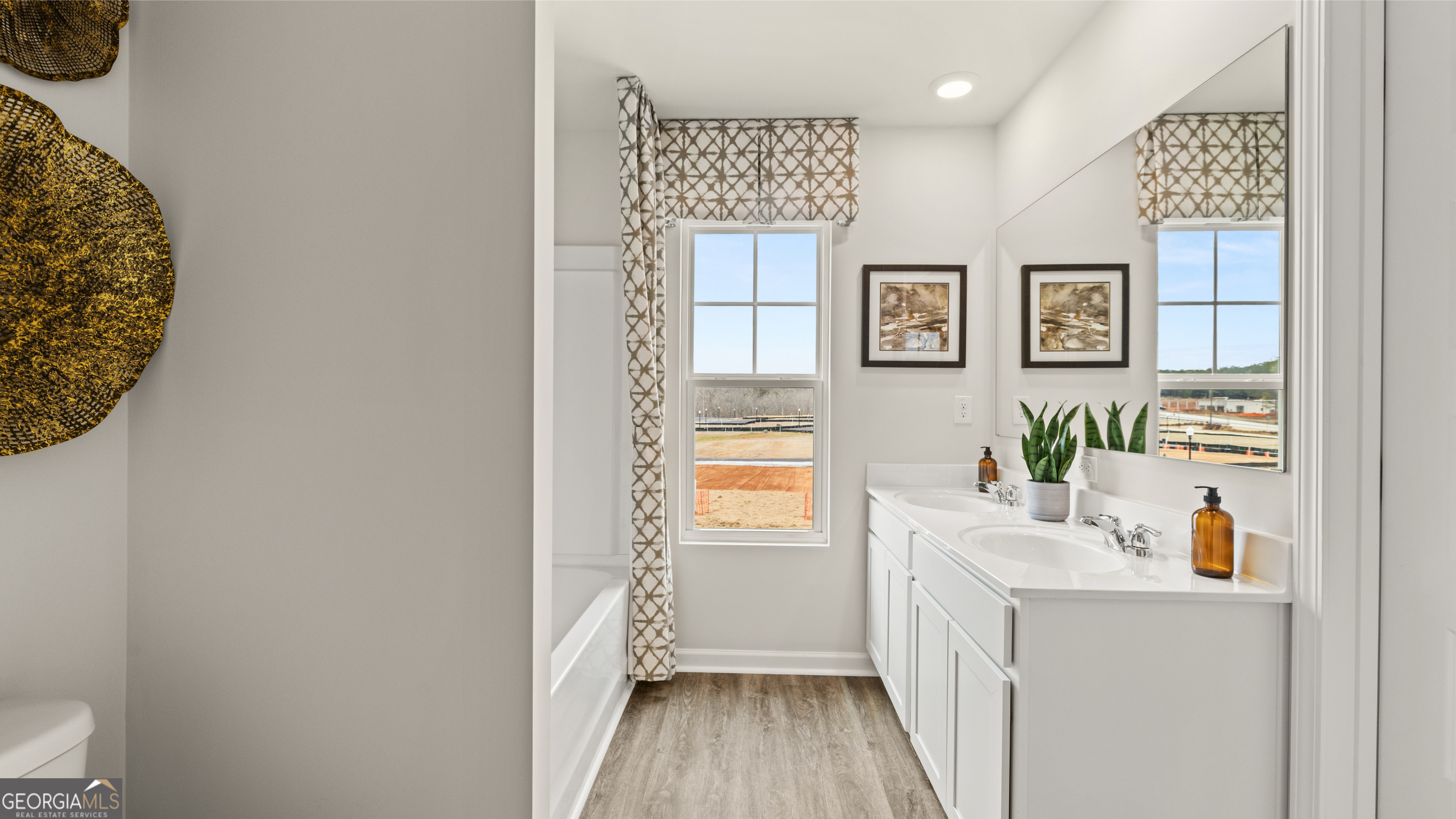 270 Sound Circle Stockbridge, GA 30281 - Photo 34 of 40 a hallway with a view of bedroom with wooden floor