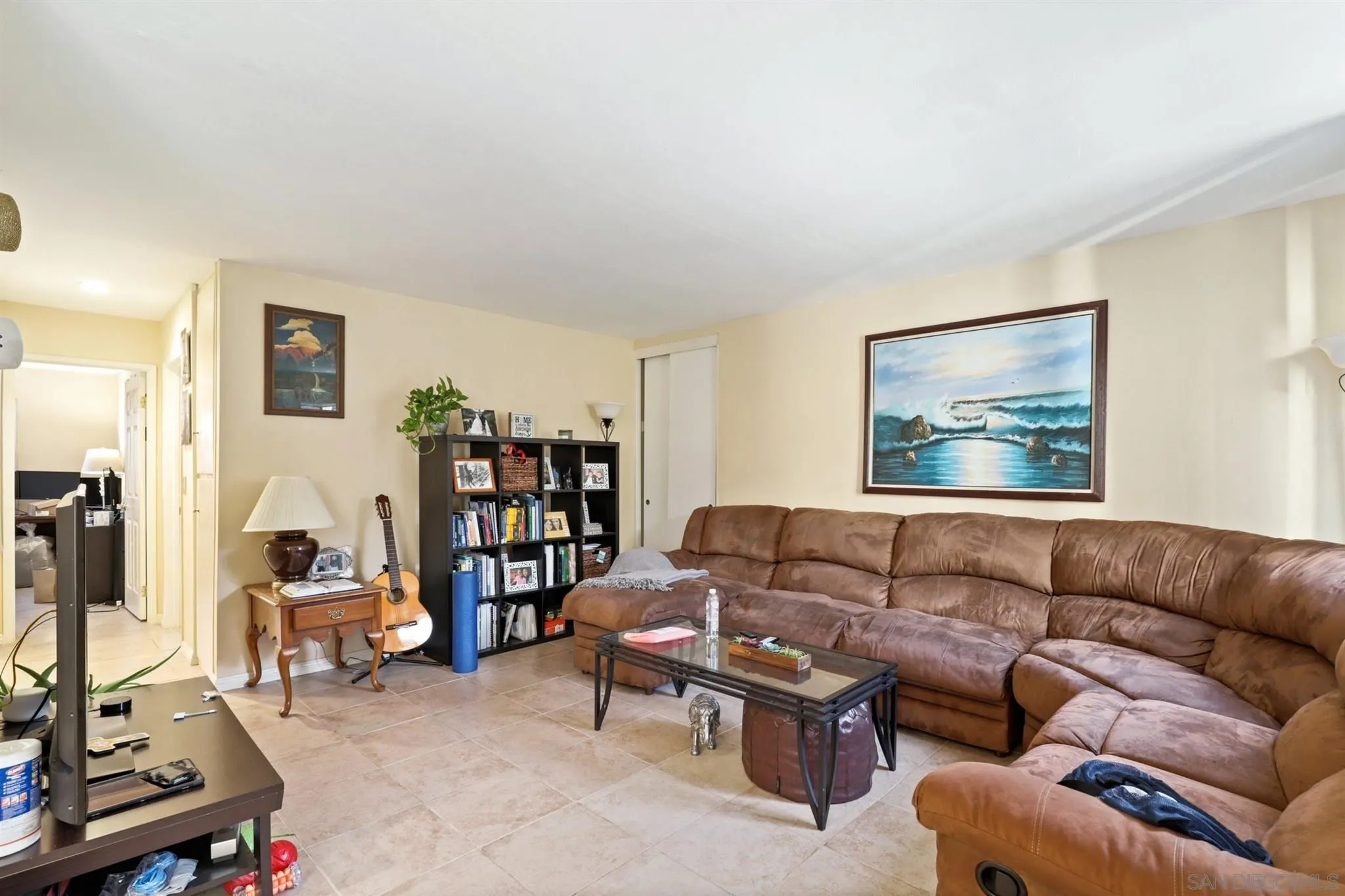 1633 Thomas Avenue San Diego, CA 92109 - Photo 15 of 48 a living room with furniture and a couch