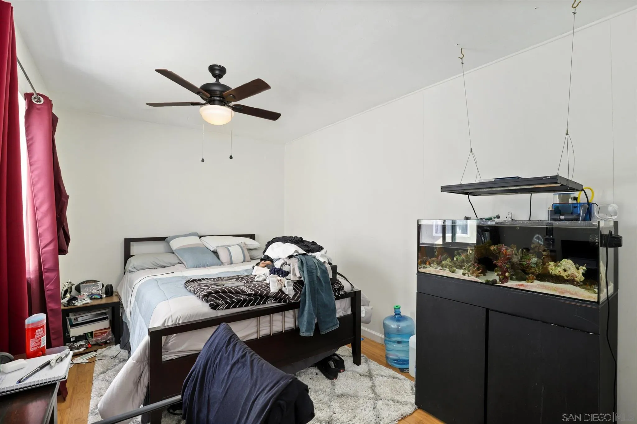 1633 Thomas Avenue San Diego, CA 92109 - Photo 23 of 48 a bed room with furniture and a window