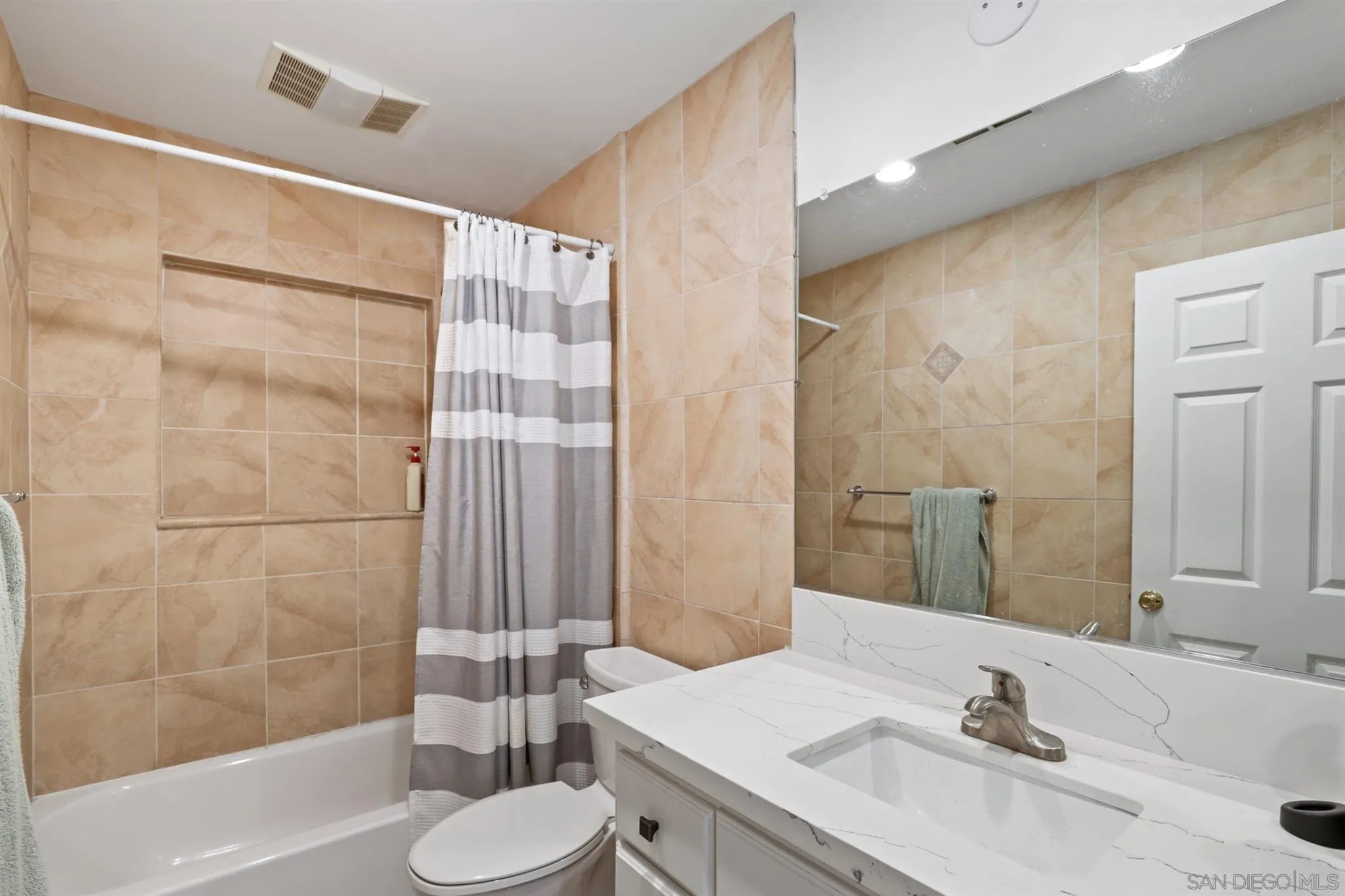 1633 Thomas Avenue San Diego, CA 92109 - Photo 34 of 48 a bathroom with a sink and a mirror