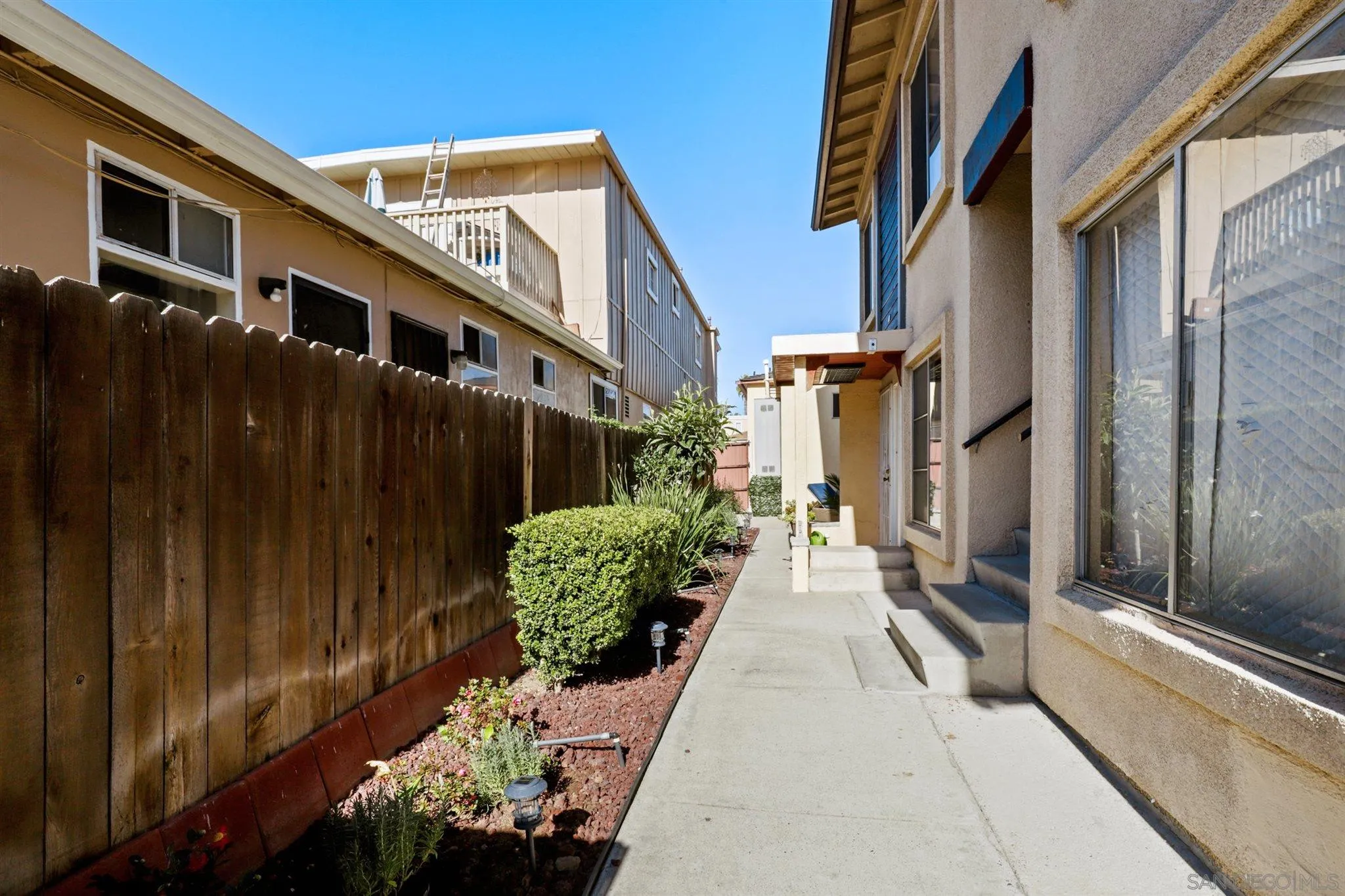 1633 Thomas Avenue San Diego, CA 92109 - Photo 36 of 48 a view of a house with a flower garden