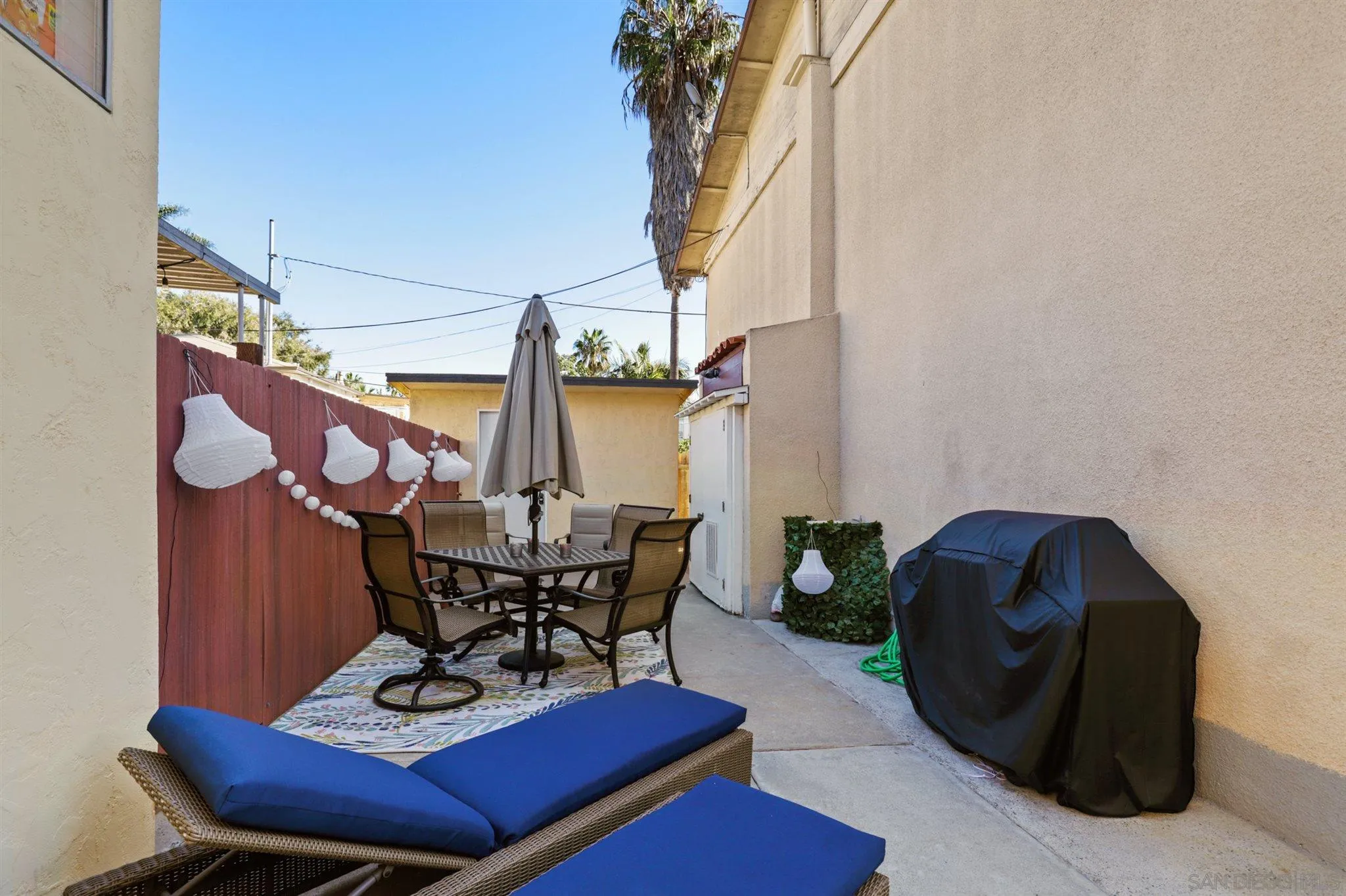 1633 Thomas Avenue San Diego, CA 92109 - Photo 38 of 48 a view of a chairs and tables in patio