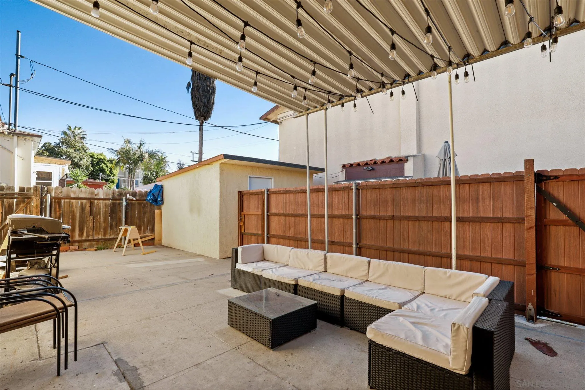 1633 Thomas Avenue San Diego, CA 92109 - Photo 41 of 48 a view of a patio with couches and potted plants