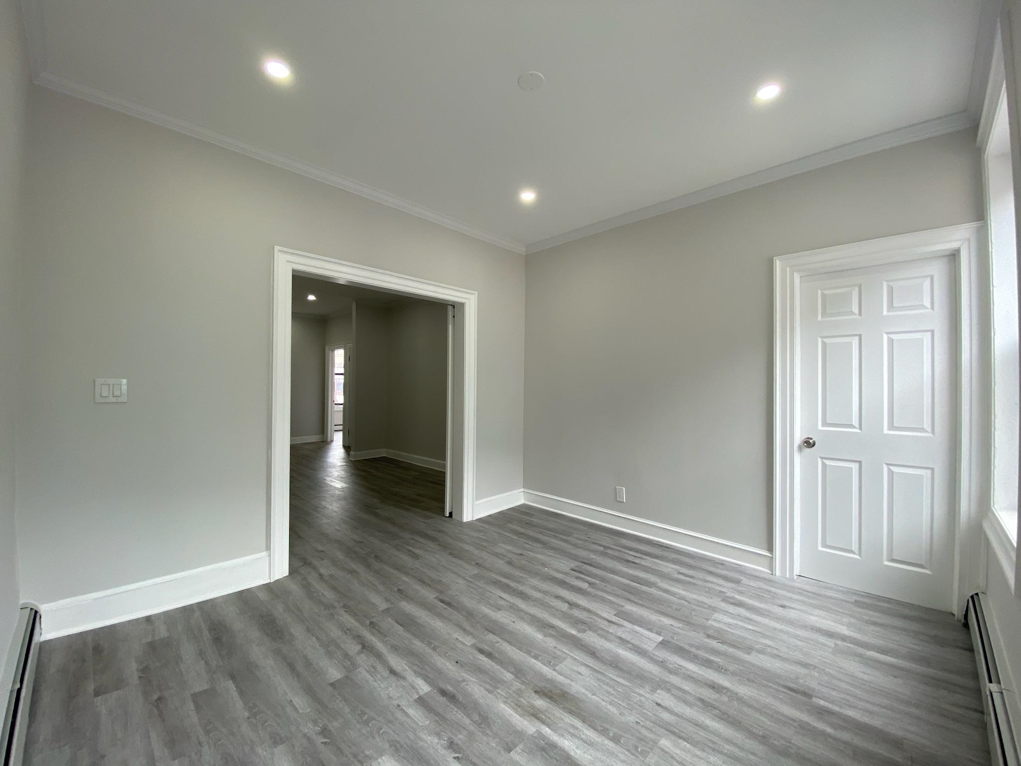 338 2nd Street, Unit 2 Jersey City, NJ 07302 - Photo 4 of 9 wooden floor in an empty room with wooden floor