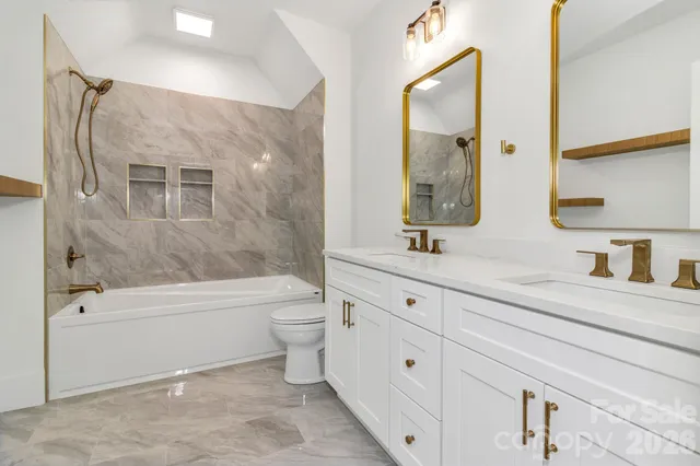 a bathroom with a bath tub and a shower