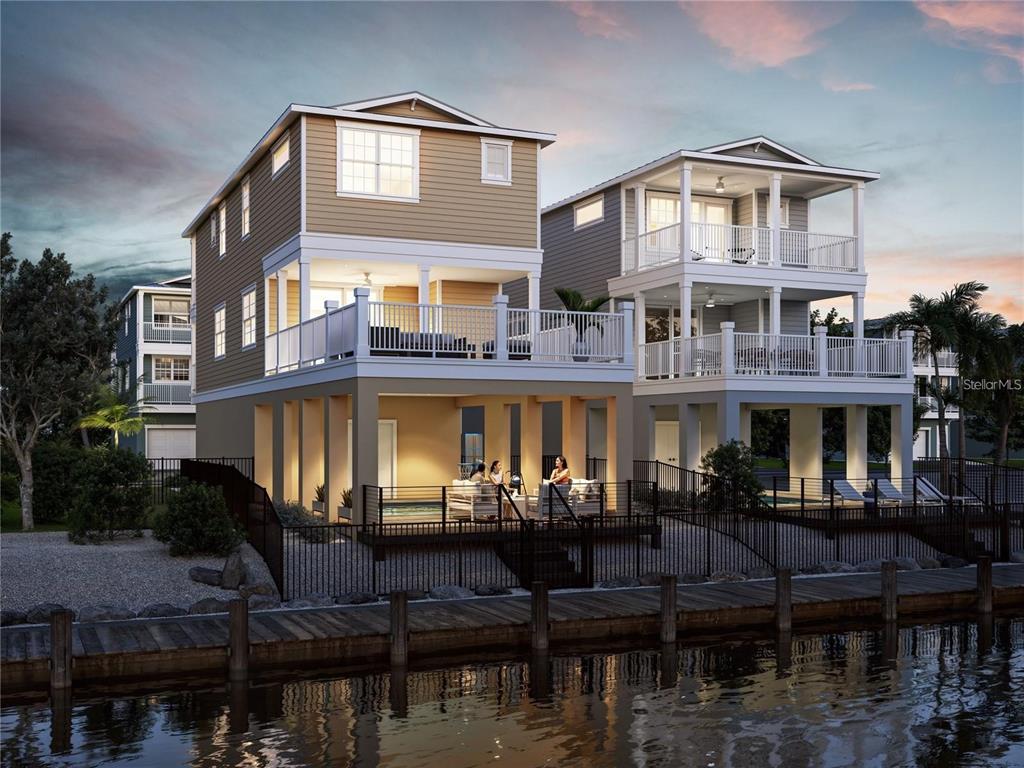 a front view of a building with lake view and a fountain