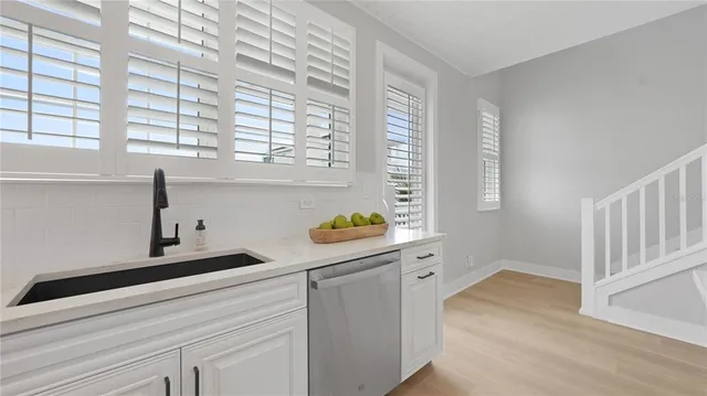 a kitchen with a window and a sink