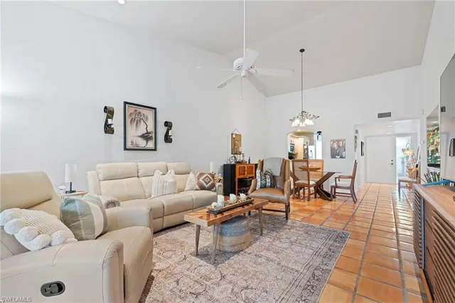 a living room with lots of furniture and a rug
