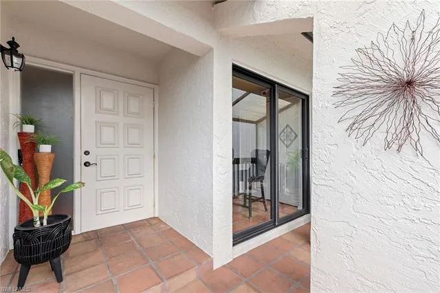a view of a hallway to rooms and livingroom