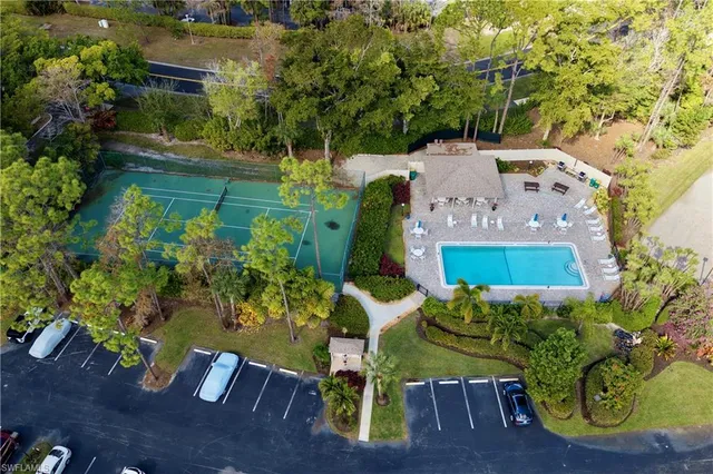 an aerial view of a house with yard swimming pool and outdoor seating