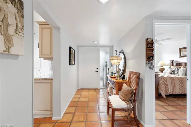 a room with furniture and a mirror