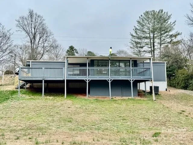 a view of a house with a yard and roof roof