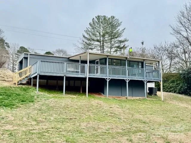 front view of a house with a yard and trees