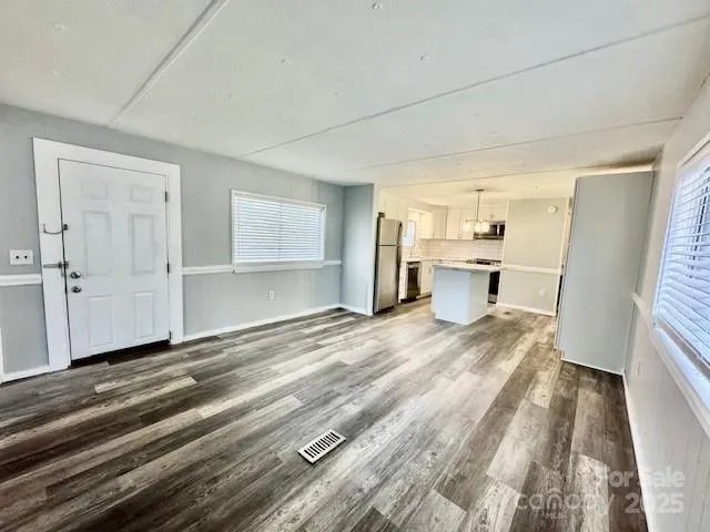a view of a kitchen and a window