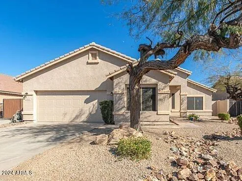 a view of a house with snow on the road