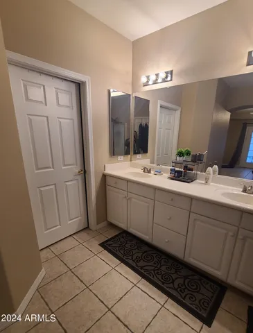 a bathroom with a sink toilet and mirror