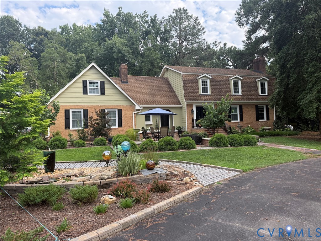 7010 Duncan Road Petersburg, VA 23803 - Photo 1 of 1 Traditional-style residence featuring a brick faca